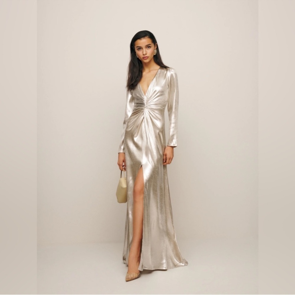This is a Reformation Gatsby Dress in a silver or champagne color new with tags
